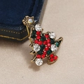Vintage gold Christmas tree brooch with colorful rhinestones on a jewelry box background - BR1250 KC Gold Christmas Tree
