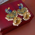 Close-up of vintage golden peacock earrings with blue enamel and pearl tassels - Peacock Blue White (Gold Steel Needle)