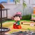 Cute resin girl doll in red and green hanfu holding a round fan with flower hair piece - Gentle Breeze Large