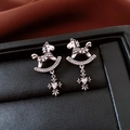 Detail of vintage silver horse earrings with sparkling zircons and a cross pendant - Silver (Silver Pin)
