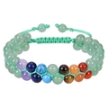 Detail view of double-layer woven bracelet with adjustable green cord and chakra stones - Green Crystal Style