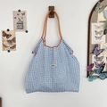 Detail of blue plaid tote bag with pink bow patterns and braided rope handles - Blue Gingham with Bowknot