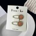 Pair of gold woven hair clips with pink sequins and glitter accents on white card - Button Decor Clip