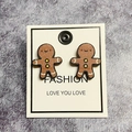 Festive gingerbread man wooden stud earrings in classic brown with white and yellow details - Gingerbread Man
