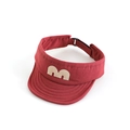 Close-up detail of a red children's sun visor with a beige M letter patch and stitching. - 52cm / Red