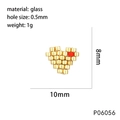 Detail of 10mm gold heart glass bead with 0.5mm hole size and technical dimensions - 10mm*8mm / Gold with Red Bead Heart (P06056)