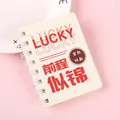 A7 spiral notebook with 80 blank pages and Lucky motivational quote on pink background - Splendid Future (1732)