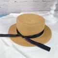 Detail of women's flat brim straw hat featuring black dotted ribbon and woven texture - M (56-58cm) / Light Coffee