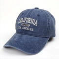 Detailed close-up of white 3D embroidery on a navy washed cotton vintage baseball cap - Navy Blue