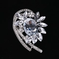 Elegant silver alloy brooch featuring a large oval crystal and sparkling rhinestones - MM-BR-0039 / Silver