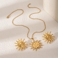 Exquisite gold metal jewelry set featuring sun pendants with spiral centers on a textured surface - Spiral Sun Shape Style (E1925)