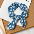 Dark blue cotton linen floral hair scarf styled in a bow on a decorative tray - Adenium Blue Base