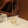 Detailed close-up of 18K gold titanium steel heart pendant with Mom engraving and zircons - Gold Heart Necklace N0455G