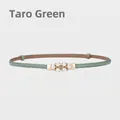 Slim light green leather belt for women featuring a pearl and rhinestone flower buckle - Taro Green
