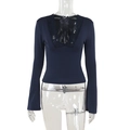 Detailed view of dark blue slim knit top with deep V-neck and delicate lace trim - S / Navy Blue