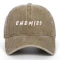 Vintage washed khaki baseball cap featuring embroidered ENEMIES logo with colorful dots - Khaki