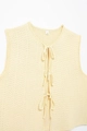 Detail of light yellow knit vest showing hollow crochet texture and three bow tie closures - S / Light Yellow