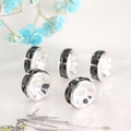 Macro detail of silver-toned spacer beads with black rhinestones for DIY jewelry making - Silver Plated Black