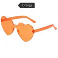 Trendy heart-shaped rimless sunglasses in translucent orange finish for parties - Orange