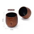 Set of two egg-shaped wooden tea mugs with 300ml capacity and natural dark grain finish - Carbonized Large Belly Cup