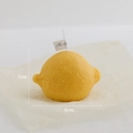Realistic yellow lemon scented candle with textured peel and white wick for home decor - Horizontal Lemon Yellow