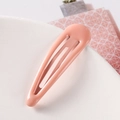 Detailed macro view of a 5cm pink candy-colored drop snap hair clip on a textured stand - Pink (S159-27)