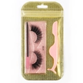 Macro view of 3D dense false eyelashes with pink brush and applicator in gold glitter bag - Gold Bag #108