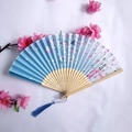 Traditional bamboo folding fan with blue gradient cherry blossom fabric and silk tassel - Blue and White Gradient Cherry Blossom Style (Women's Fan - 33)