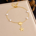 Detail of gold starfish and shell charms with five pearl beads on a stainless steel anklet - Shell & Starfish Pearl Style (B1697)
