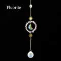 Hanging fluorite crystal suncatcher with golden sun motifs and faceted prism ball - Fluorite