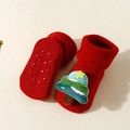 Detail of red baby Christmas sock with 3D tree and anti-slip silicone dots on sole - Christmas Tree