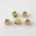 Macro view of five cube-shaped beads featuring gold frames and blue enamel floral motifs - 26# Hollow Square Bead 10mm / 1 Piece