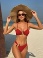 Detail of red ribbed bikini top with center gemstone buckle and thin shoulder straps - Red
