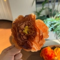 Detail of caramel orange peony hair clip with realistic layered fabric petals and yellow stamen - Chocolate Orange - Artificial Flower Clip