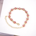 Bracciale bohémien dorato con ciondoli occhio del male rossi e zirconi scintillanti - Rosso