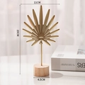Golden palm leaf metal ornament on round wooden base for modern home decor, 20cm height - Palm Leaf-Gold