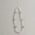 Macro detail of tulip beaded phone strap with clear faceted beads and pink floral charms - Tulip Phone Chain