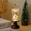 Christmas snowman snow globe candle light with bronze base and glitter fluid - Small Tall Candle Calling Snowman