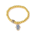 Detailed view of gold beaded elastic bracelet with Hamsa Hand and Evil Eye charms - Gold (White Pendant)