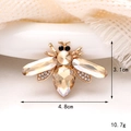 Macro detail of a golden bee brooch with champagne rhinestones and size dimensions - Gem Bee Champagne