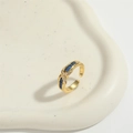 Minimalist adjustable golden X-shaped ring with blue rectangular stones and zircon accents - Blue Zircon Cross Gold (JZ0605-3)