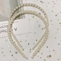 Detail view of pearl and rhinestone headbands set on soft white sequin mesh background - Style D Pure Pearl Rhinestone Headband 2-Piece Set