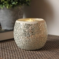 Silver mosaic glass candle holder with mirror pieces on woven mat with lit candle - Broken Silver Moonlight