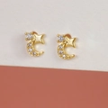 Elegant gold-plated star and moon earrings with white zircon on a minimalist background - Star Moon Zirconia Stud Earrings