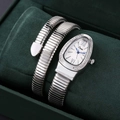 Detail of silver snake-shaped tubogas watch with diamond-set bezel in a green velvet box - Silver White Face