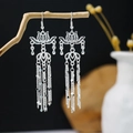Silver vintage Hmong lotus earrings with long tassel fringe on rustic wood branch - Hollow Lotus Fine Chain Tassel Style (E1967-3)