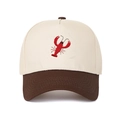Close-up of lobster embroidery on contrast color cotton baseball cap with neat stitching - Coffee