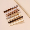 Set di 7 fermagli per capelli in acetato con motivo marmorizzato in vari colori neutri e oro - Set da 7