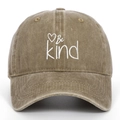 Close-up of Be Kind embroidery and heart pattern on washed cotton baseball cap - Khaki