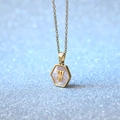 Hexagon gold titanium necklace featuring white shell inlay and letter W pendant - Letter W